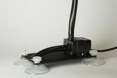 A Coltiva centrifugal pump on a suction-cup mounting bracket.